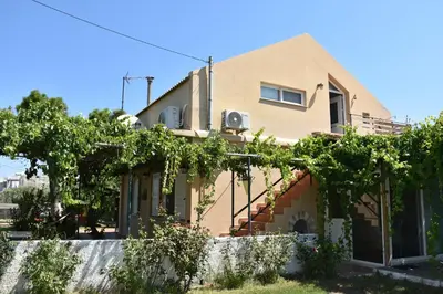 a house with vines on the side of it at Villa Gerani in Gerani Chanion