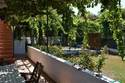 a garden with a bench and some plants and trees at Villa Gerani in Gerani Chanion