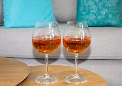 two glasses of wine sitting on a table at GreenView Chania Center Luxury Suite in Chania Town