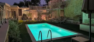 a swimming pool in the yard of a house at Achlades The Mountain Paradise Villas - Studio with pool! in Aletrouvárion