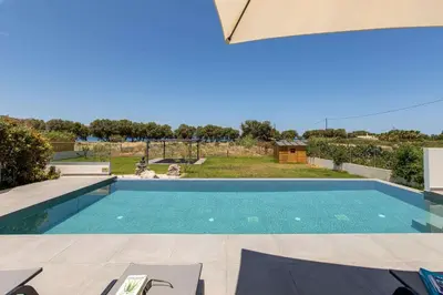 an image of a swimming pool in a house at Diktamos Villa by Vintage Travel in Tavronitis