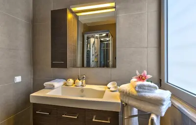 a bathroom with a sink and a mirror at Gramvousa Villas in Kissamos
