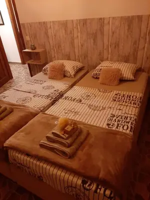 two beds with towels on them in a room at Villa Aris in Crete with private pool en private parking! in Neo Chorio