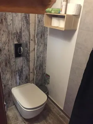 a bathroom with a white toilet in a room at Villa Aris in Crete with private pool en private parking! in Neo Chorio