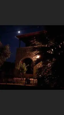 a stone tower with a moon in the sky at Villa Aris in Crete with private pool en private parking! in Neo Chorio
