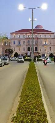 a street in front of a large building with cars at Color Living in Chania Town
