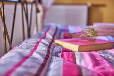 two books sitting on top of a bed at Villa Evenos with private pool in Elafonisi