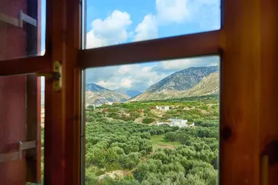 a window view of a mountain view from a train at Villa Evenos with private pool in Elafonisi