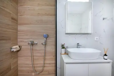 a bathroom with a sink and a shower at Villa Pervana- Private pool - Close to the Beach in Arménoi