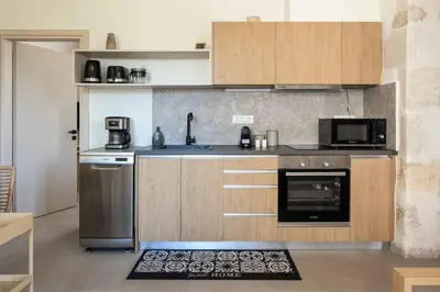a kitchen with a sink and a stove at Villa Eva Chania in Neo Chorio