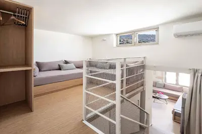 a room with a bunk bed and a living room at Villa Eva Chania in Neo Chorio