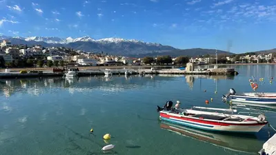 a boat is docked in a body of water at Kalimera Kalyves Apartment in Kalyves