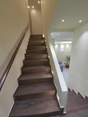 a staircase in a house with wooden floors at Breeze Apartment in Chania Town