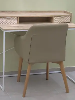 a chair sitting in front of a desk at Breeze Apartment in Chania Town