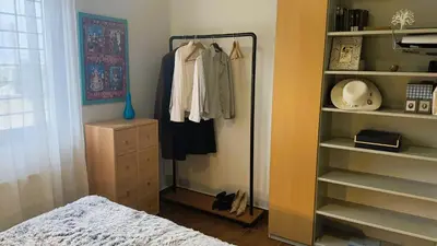 a bedroom with a closet with a bed and a dresser at La Casa di Corina in Kato Daratso