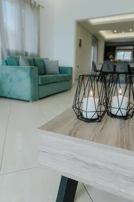 two lights on a table in a living room at AITHRA seaside in Arónion