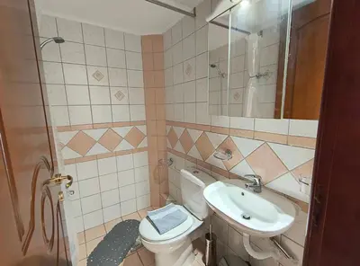 a bathroom with a toilet and a sink at Angie A1 close to the beach by 8essentially in Chania Town