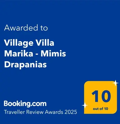 a yellow sign with the text awarded to village villa marica miniatures diagrams at Village Villa Marika Drapanias in Drapaniás