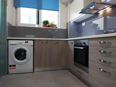 a kitchen with a washing machine and a washer at Dimitrios Cozy Apartment in Chania Town