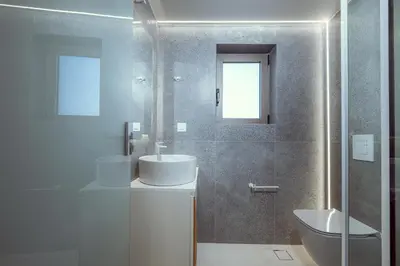 a bathroom with two sinks and a toilet at Ethereal White Villas in Gramvousá
