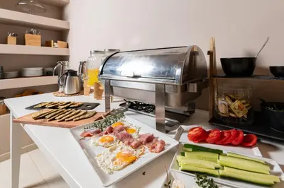 a kitchen counter with a grill with food on it at Mear Luxury Holiday Homes - Cretan Sunny Gems in Kountoura Selino