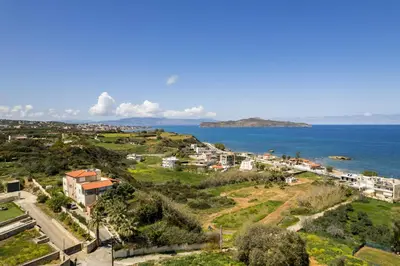 a view of a city and the ocean at Zen Luxury Studio in Kalamaki Chanion