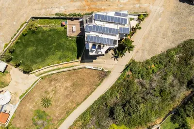 an overhead view of a house with solar panels on it at Zen Luxury Studio in Kalamaki Chanion