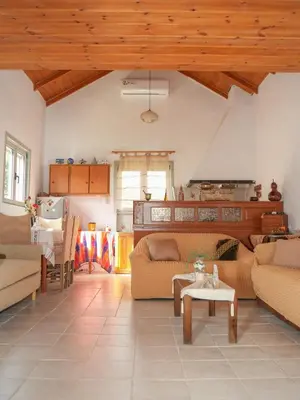 a living room with couches and a table at Sternes house in Stérnai