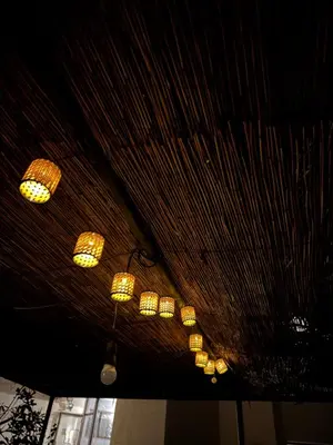 a bunch of chandeliers hanging from a ceiling at Mike's appartments in Chania Town