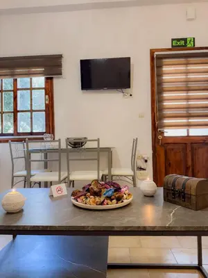 a plate of food on a table in a room at Mike's appartments in Chania Town