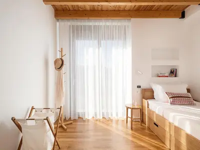 a bedroom with a large bed and a window at Villa Melista in Kounoupidhianá