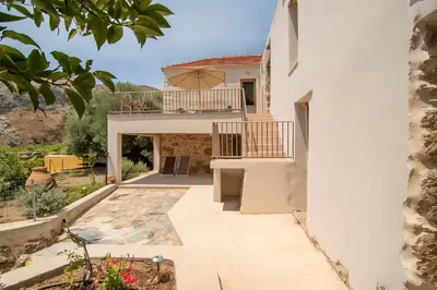 a villa with a view of the house at Το Ρόδι Voutas Cottage house in Palaiochóra