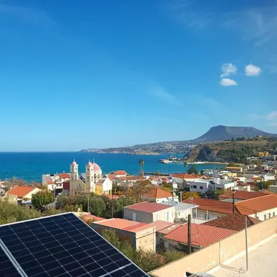 a view of a city with solar panels on the roof at Elysian Garden in Kalyves