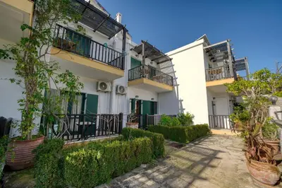 an apartment building with balconies and plants at Elysian Garden in Kalyves