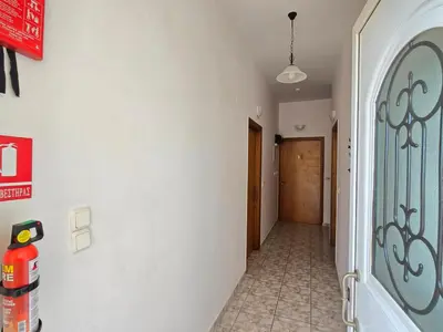 a hallway with a door and a hallway sidx sidx at Inna Rooms in Fournádhos