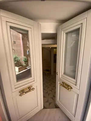 two doors in a room with a hallway at Reas House in Chania Town