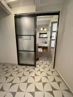 a kitchen with a refrigerator in a room at Reas House in Chania Town