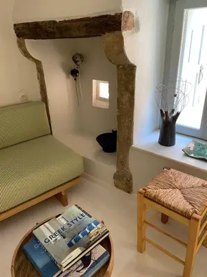 a living room with a couch and a table at Reas House in Chania Town