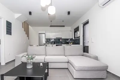 a living room with a couch and a table at Tolis Exclusive Villa in Kissamos
