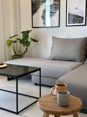 a living room with a couch and a coffee table at Etherio Urban Loft in Chania Town