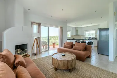a living room with a couch and a table at Villa Xamadochori in Xamoudhokhórion