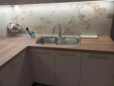 a kitchen with a stainless steel sink on a counter at Golden Orb in Chania Town