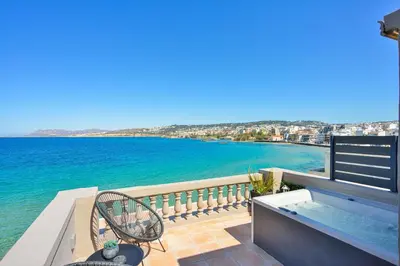 a balcony with a view of the water at Kumka seafront suite in Chania Town
