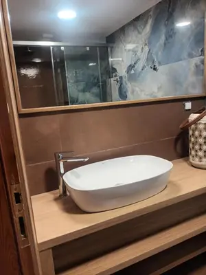 a white sink on a counter in a bathroom at Mairy's Apts Paleochora Mimagia in Palaiochóra