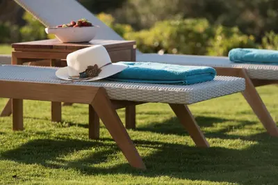 a picnic table with a hat and a napkin on it at Villa Ianira in Kolymvari