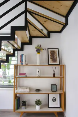 a room with a book shelf and stairs at Serena Residence in Chania Town