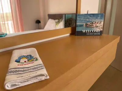 a book sitting on top of a wooden table at Villa Anastasia Sissy in Módhion