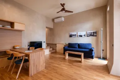 a living room with a blue couch and a table at Apartment in Chania old town in Chania Town