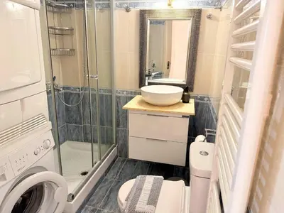 a bathroom with a toilet and a sink and a shower at Little Central Apartment-1min walk from everywhere in Chania Town