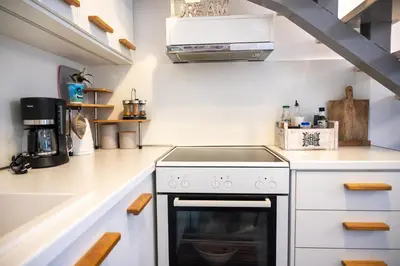 a kitchen with white counters and a stove top oven at Casa Ellini unique & spacious by 8essentially in Kókkinos Pírgos